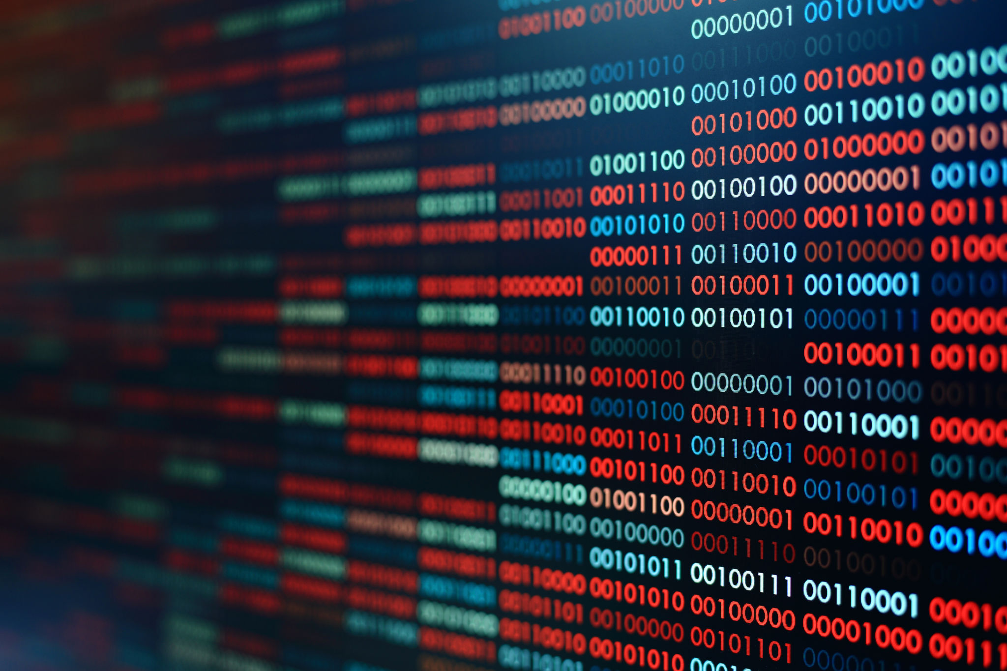 Binär data, alltså nollor och ettor, i rött och blått.