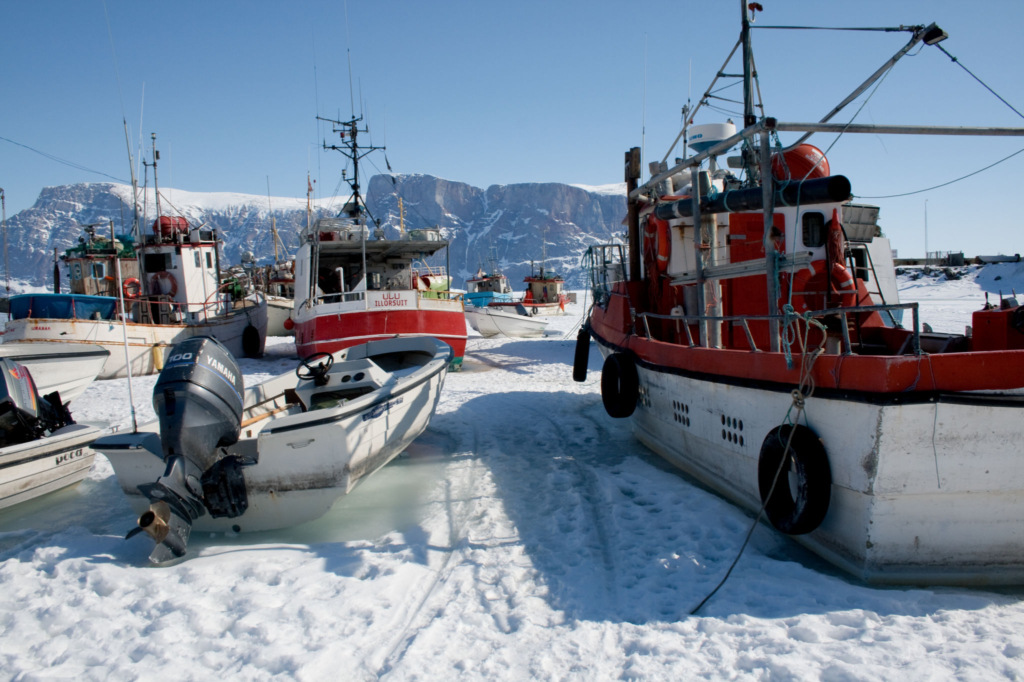 Boats in the ice in Uummannaq, Greenland