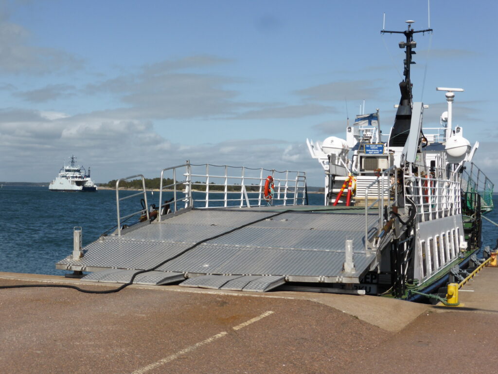 Blue-white ferry at the dock.