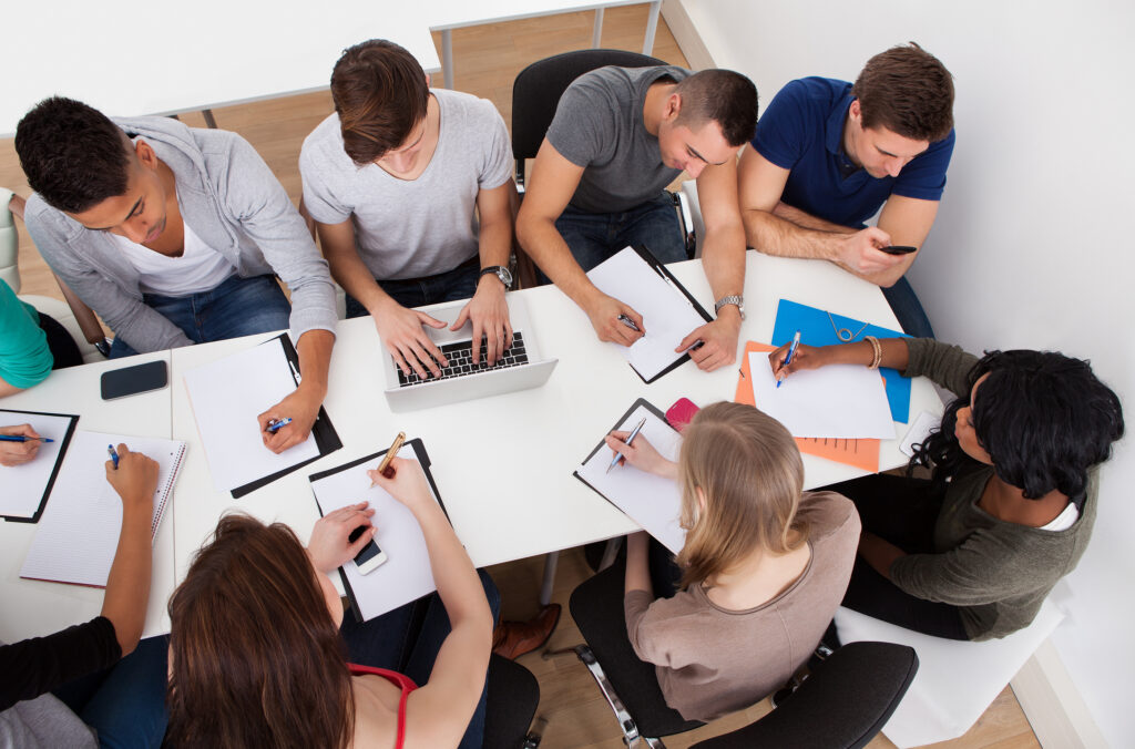 Students around a table.