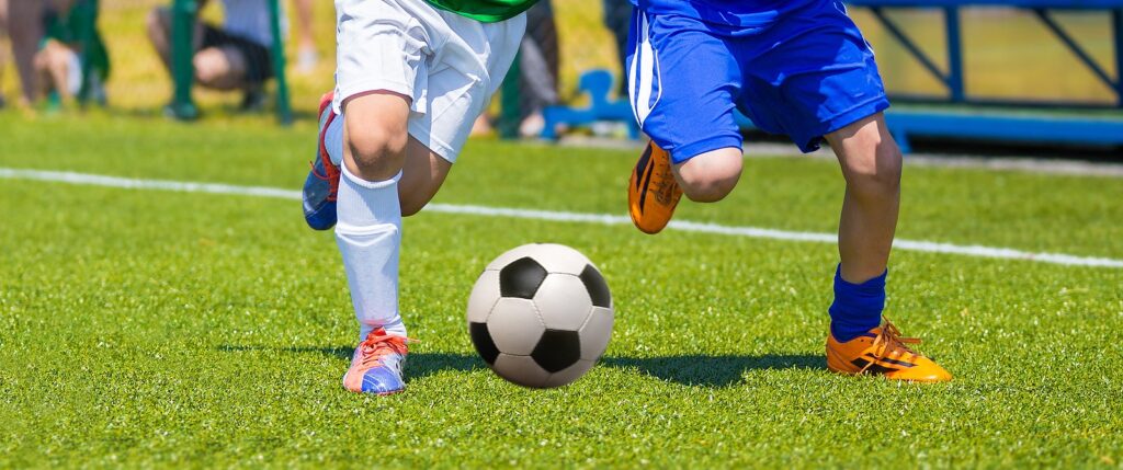 Feet playing football.
